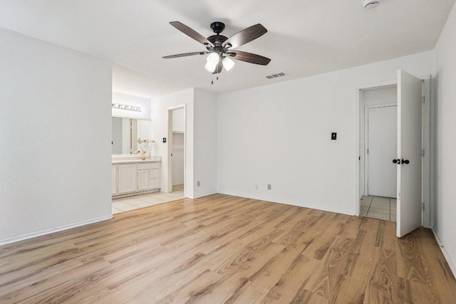 1613 J J Seabrook Dr, Austin, TX 78721 - unfurnished room with ceiling fan and light wood-style flooring