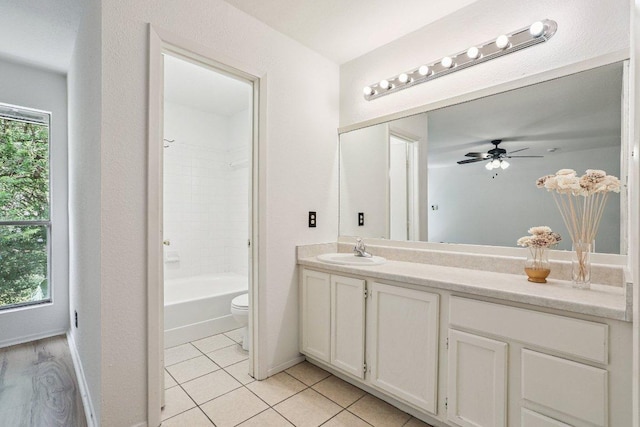 1613 J J Seabrook Dr, Austin, TX 78721 - bathroom with vanity, tile patterned flooring, shower / tub combination, and ceiling fan