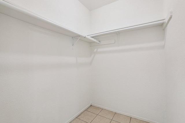 1613 J J Seabrook Dr, Austin, TX 78721 - spacious closet featuring light tile patterned floors