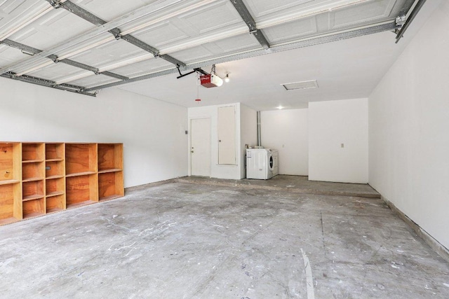 1613 J J Seabrook Dr, Austin, TX 78721 - garage with washer and dryer and a garage door opener