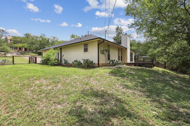 1613 J J Seabrook Dr, Austin, TX 78721 - rear view of house featuring a gate, a chimney, and a deck