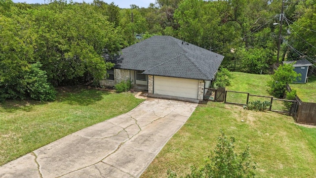 1613 J J Seabrook Dr, Austin, TX 78721 - view of front of home with a gate, concrete driveway, an attached garage, stone siding, and a shingled roof