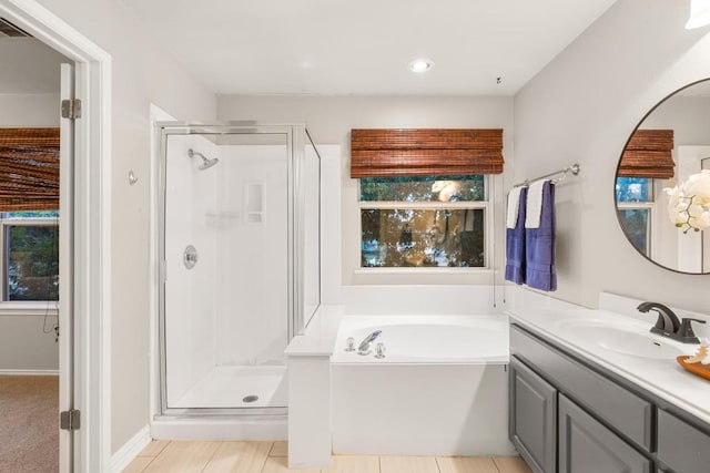 2716 Cradlerock Ter, Austin, TX 78748 - bathroom with a shower stall, vanity, a bath, and recessed lighting