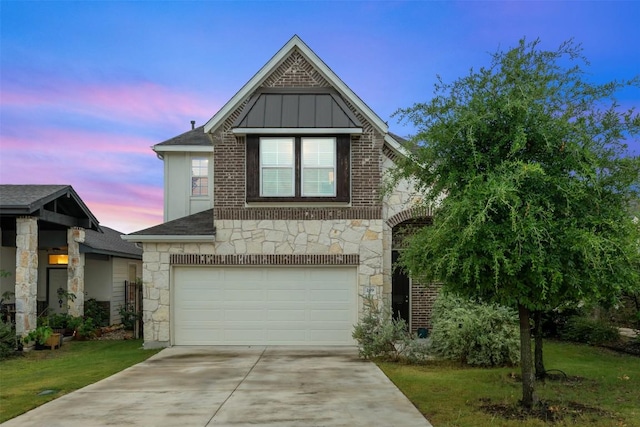 209 Lambert St, Leander, TX 78641 - view of front facade featuring stone siding, an attached garage, concrete driveway, board and batten siding, and a shingled roof