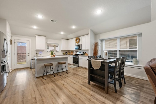209 Lambert St, Leander, TX 78641 - dining space featuring light wood-type flooring and recessed lighting