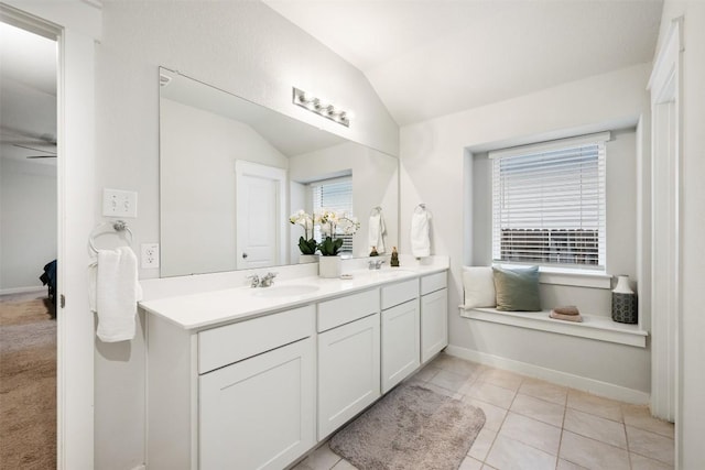 209 Lambert St, Leander, TX 78641 - full bathroom featuring lofted ceiling, double vanity, and tile patterned flooring