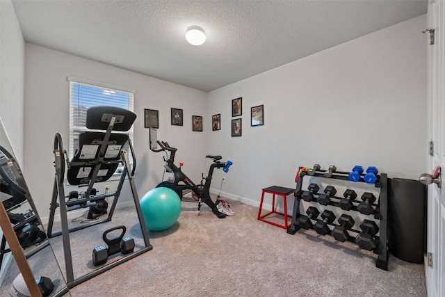 209 Lambert St, Leander, TX 78641 - exercise area with a textured ceiling and carpet