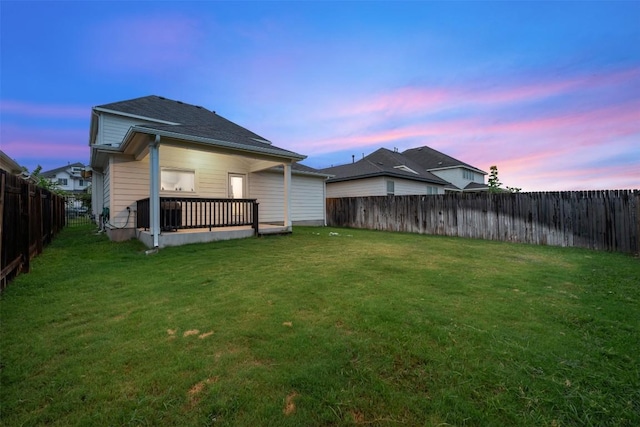 209 Lambert St, Leander, TX 78641 - back of property at dusk with a fenced backyard
