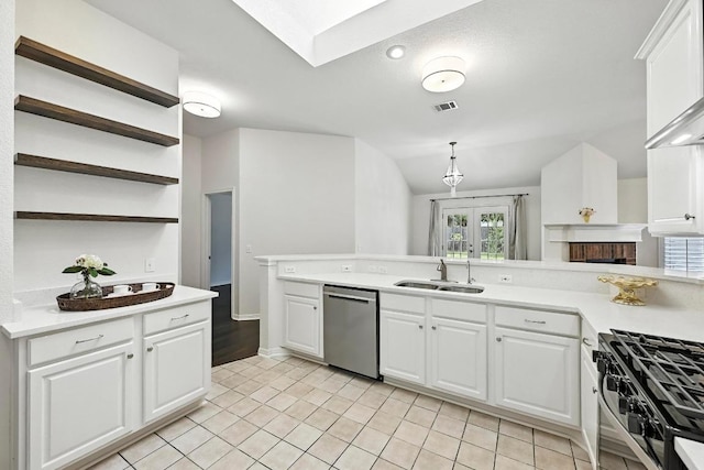 6428 Clay Allison Pass, Austin, TX 78749 - kitchen featuring dishwasher, light countertops, open shelves, white cabinetry, and vaulted ceiling
