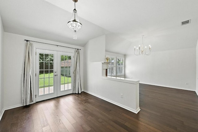 6428 Clay Allison Pass, Austin, TX 78749 - unfurnished dining area featuring a chandelier, french doors, dark wood finished floors, and lofted ceiling