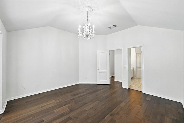 6428 Clay Allison Pass, Austin, TX 78749 - empty room with vaulted ceiling, a chandelier, and dark wood finished floors