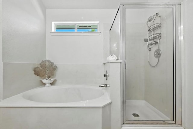 6428 Clay Allison Pass, Austin, TX 78749 - bathroom featuring a garden tub and a shower stall