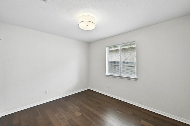 6428 Clay Allison Pass, Austin, TX 78749 - spare room with dark wood-style flooring and baseboards