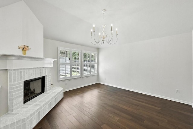 6428 Clay Allison Pass, Austin, TX 78749 - unfurnished living room featuring a chandelier, dark wood finished floors, and a fireplace
