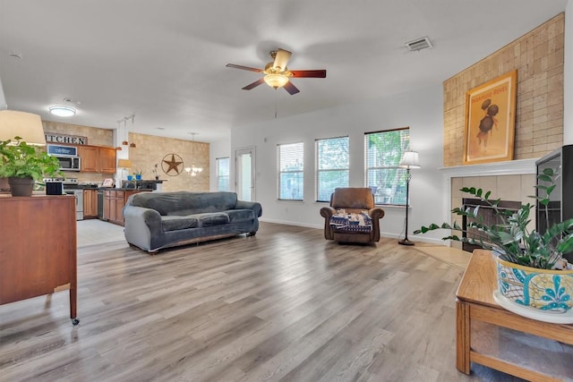2101 Charlotte Estates Dr, Austin, TX 78744 - living room with a ceiling fan and light wood-type flooring
