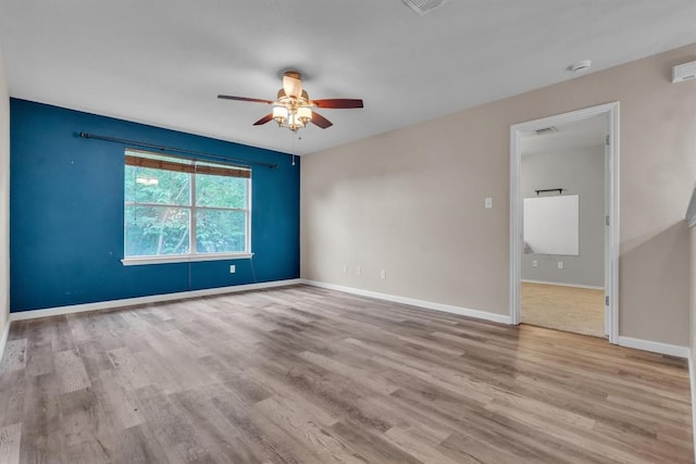 2101 Charlotte Estates Dr, Austin, TX 78744 - unfurnished room with a ceiling fan, wood finished floors, and a smoke detector