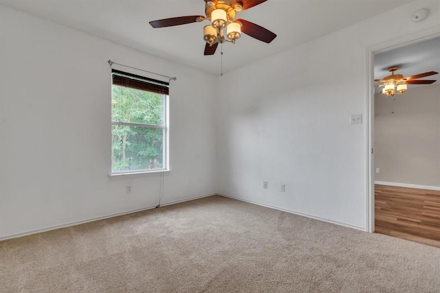 2101 Charlotte Estates Dr, Austin, TX 78744 - spare room featuring ceiling fan, carpet floors, and a smoke detector