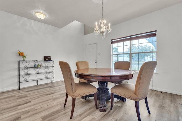2101 Charlotte Estates Dr, Austin, TX 78744 - dining area featuring a chandelier and light wood-type flooring
