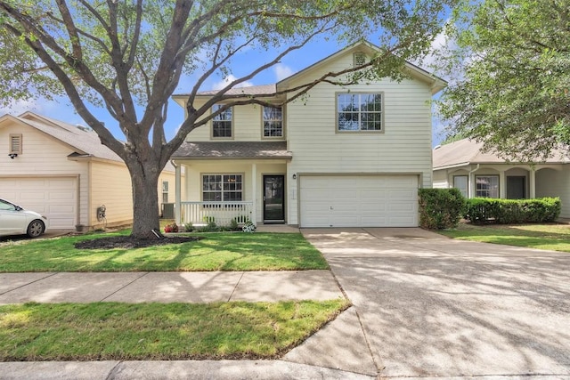2101 Charlotte Estates Dr, Austin, TX 78744 - traditional-style home with an attached garage, driveway, a front lawn, and a porch