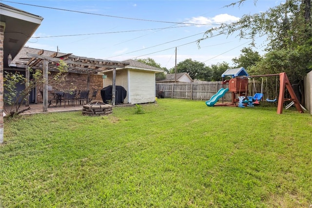 5804 Sheffield Terrace Ln, Bryan, TX 77802 - fenced backyard featuring a pergola, a playground, and a fire pit