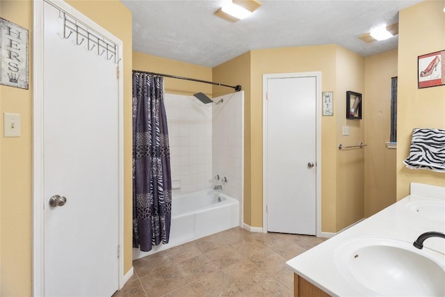 5804 Sheffield Terrace Ln, Bryan, TX 77802 - full bath with shower / bathtub combination with curtain, double vanity, and a textured ceiling