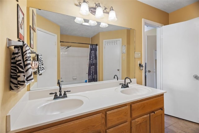 5804 Sheffield Terrace Ln, Bryan, TX 77802 - bathroom featuring double vanity, tile patterned flooring, and shower / bath combo