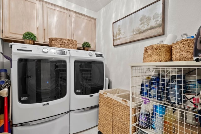 10839 Redmond Rd, Austin, TX 78739 - laundry area featuring cabinet space and independent washer and dryer