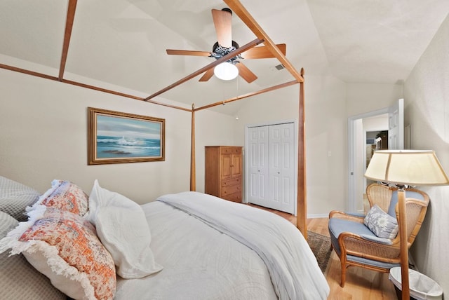 10839 Redmond Rd, Austin, TX 78739 - bedroom featuring vaulted ceiling, light wood-style floors, a ceiling fan, and a closet