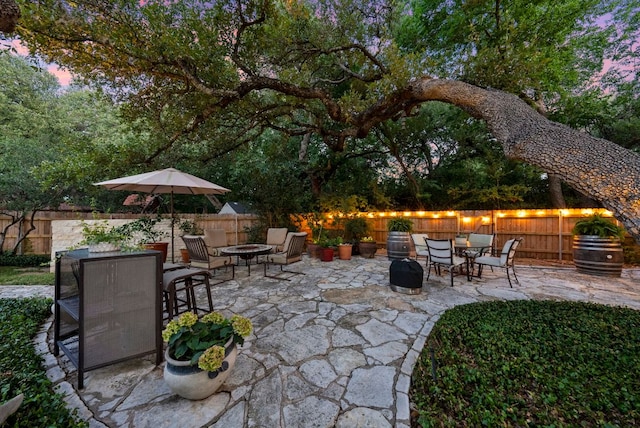10839 Redmond Rd, Austin, TX 78739 - fenced backyard with an outdoor fire pit, a patio area, and outdoor dining area