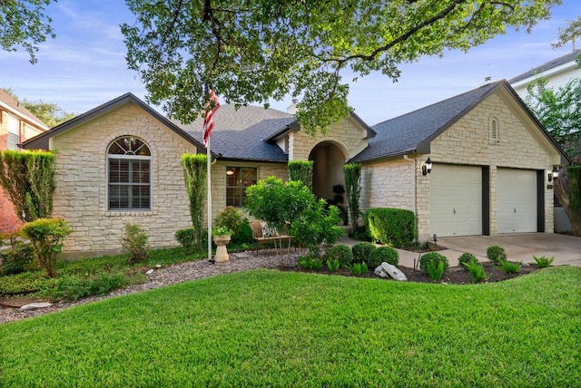 10839 Redmond Rd, Austin, TX 78739 - view of front of house featuring stone siding, a front yard, an attached garage, concrete driveway, and roof with shingles