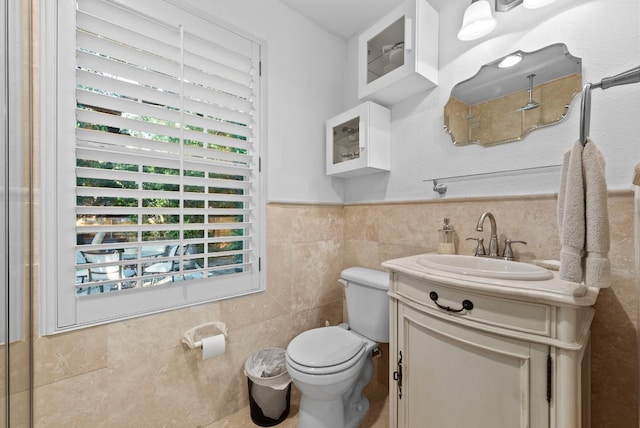 10839 Redmond Rd, Austin, TX 78739 - bathroom with tile walls, vanity, and wainscoting