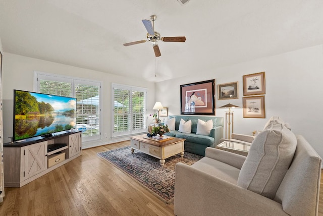 10839 Redmond Rd, Austin, TX 78739 - living area with light wood finished floors and ceiling fan