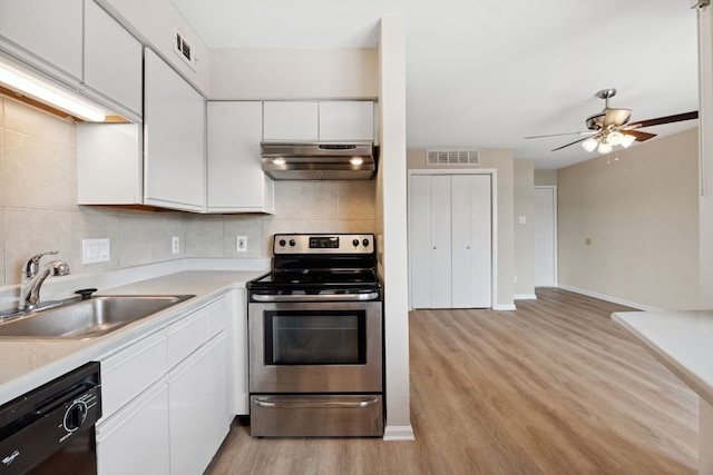 1840 Burton Dr Unit 155, Austin, TX 78741 - kitchen featuring stainless steel electric range, under cabinet range hood, dishwasher, light wood-style flooring, and white cabinetry