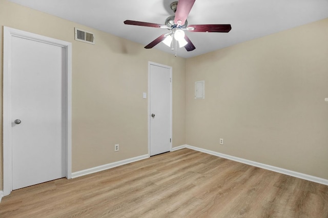 1840 Burton Dr Unit 155, Austin, TX 78741 - unfurnished bedroom featuring light wood-style floors and ceiling fan