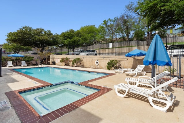 1840 Burton Dr Unit 155, Austin, TX 78741 - community pool featuring a hot tub and a patio