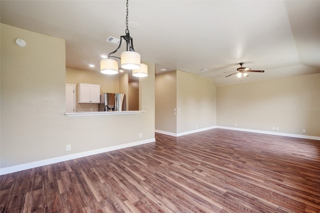 136 Holmstrom St, Hutto, TX 78634 - unfurnished living room featuring dark wood-type flooring and a ceiling fan