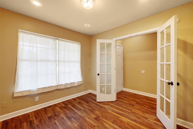 136 Holmstrom St, Hutto, TX 78634 - spare room featuring french doors, wood finished floors, and recessed lighting