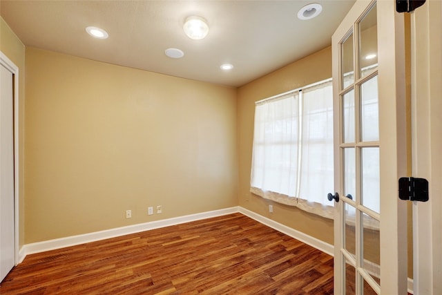 136 Holmstrom St, Hutto, TX 78634 - empty room with wood finished floors and recessed lighting
