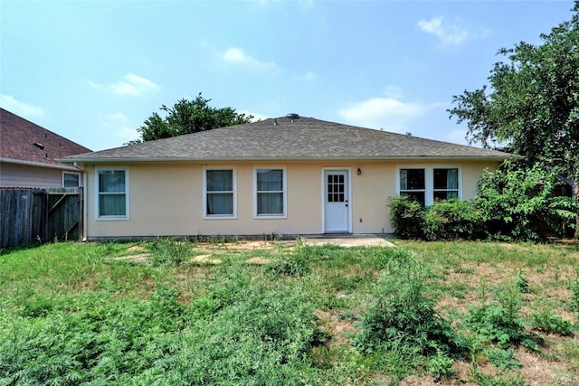 136 Holmstrom St, Hutto, TX 78634 - rear view of house with stucco siding