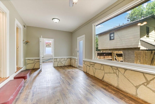 4415 Ave D Ave, Austin, TX 78751 - unfurnished dining area with wood finished floors and a wainscoted wall