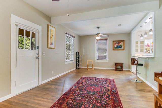 4415 Ave D Ave, Austin, TX 78751 - foyer featuring a ceiling fan, plenty of natural light, wood finished floors, and beam ceiling