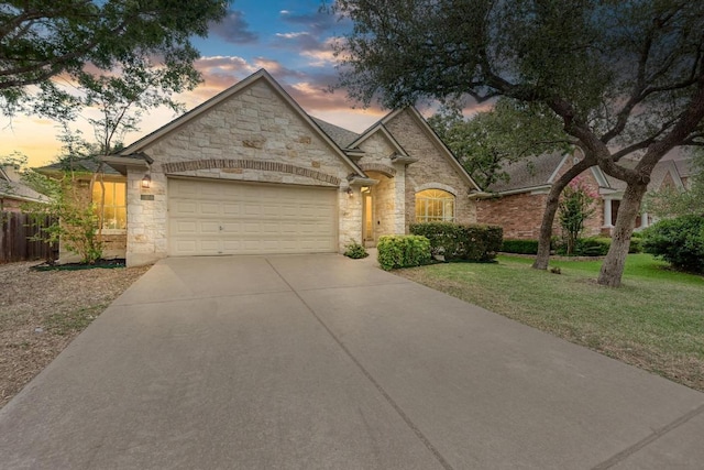518 Victoria Dr, Cedar Park, TX 78613 - french country home featuring stone siding, driveway, and an attached garage