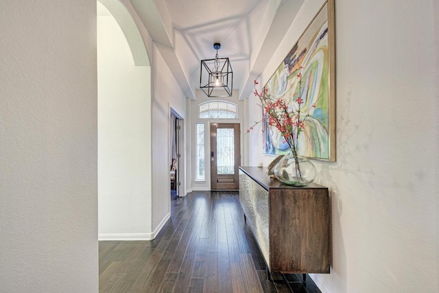 518 Victoria Dr, Cedar Park, TX 78613 - foyer featuring arched walkways, dark wood finished floors, and a chandelier