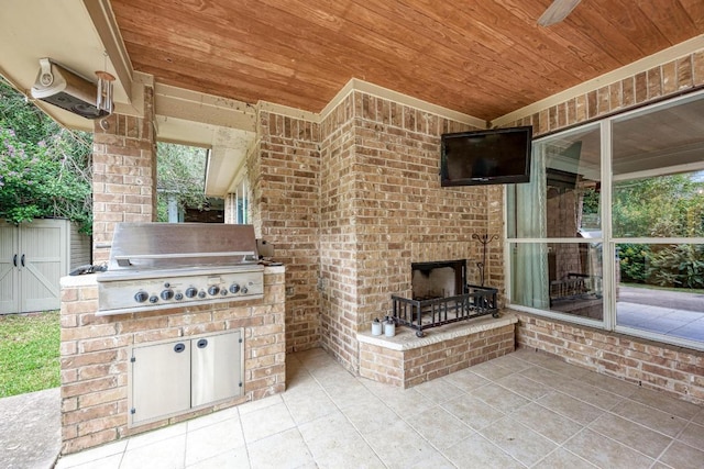 518 Victoria Dr, Cedar Park, TX 78613 - view of patio / terrace with an outdoor brick fireplace and an outdoor kitchen