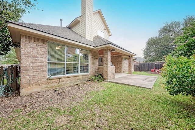 518 Victoria Dr, Cedar Park, TX 78613 - rear view of house featuring brick siding, a patio, a chimney, and roof with shingles