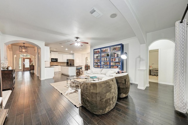 518 Victoria Dr, Cedar Park, TX 78613 - living area featuring arched walkways, ceiling fan, dark wood finished floors, and recessed lighting