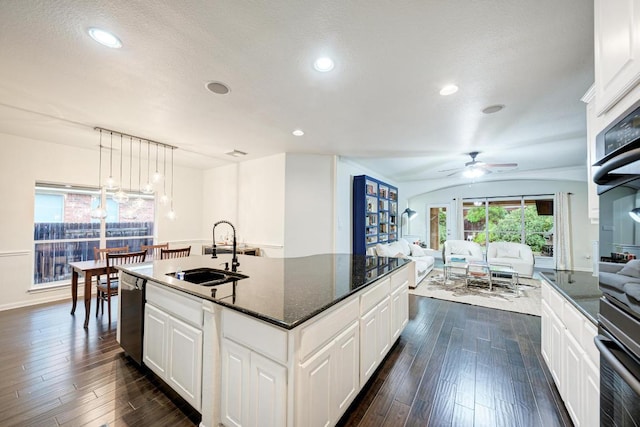 518 Victoria Dr, Cedar Park, TX 78613 - kitchen with ceiling fan, dark wood-type flooring, open floor plan, white cabinetry, and recessed lighting