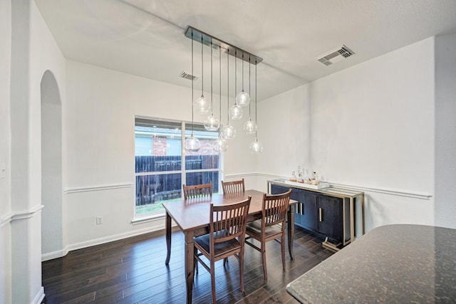 518 Victoria Dr, Cedar Park, TX 78613 - dining space with dark wood-style floors and arched walkways