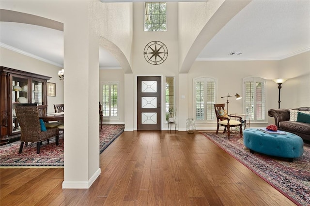 4004 Callabero Cv, Round Rock, TX 78681 - entrance foyer featuring hardwood / wood-style floors, healthy amount of natural light, and ornamental molding