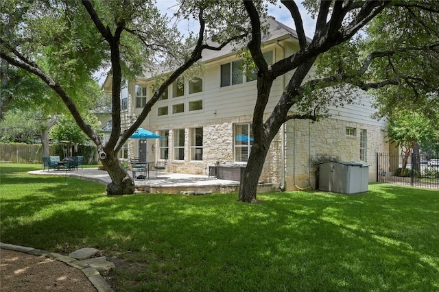 4004 Callabero Cv, Round Rock, TX 78681 - back of property with stone siding and a patio area